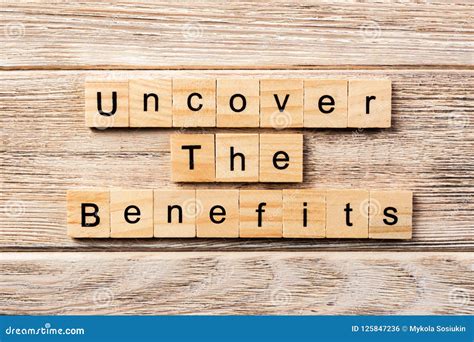 Uncover the Benefits Word Written on Wood Block. Uncover the Benefits