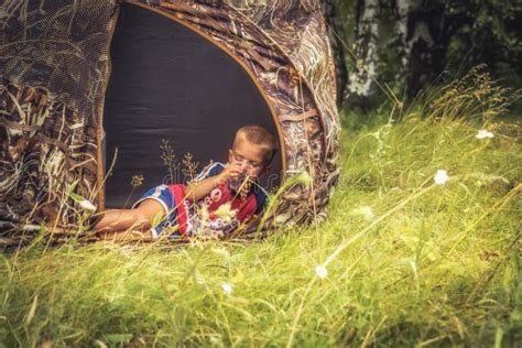Child Boy Resting In Camping Tent In Countryside Summer Camp Concept