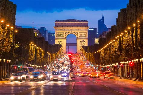 Avenue Des Champs Elysees Night View Of The Arc De Triomphe And The