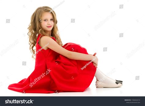 Cute Preteen Girl Sitting On Floor ภาพสต็อก แก้ไขตอนนี้ 1760422214