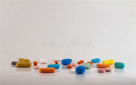 Drugs In The Form Of Pills Of Different Sizes Shapes And Colors Stock