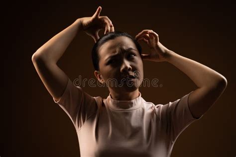 Asian Woman Scratching Her Head Standing Isolated On Beige Background Stock Image Image Of
