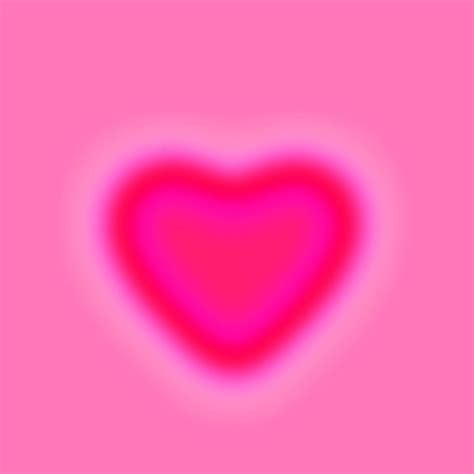 A Pink Heart Shaped Object On A Pink And Purple Background With The