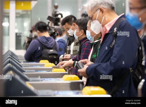 Travelers Wait For The Gate To Open At Lo Wu Control Point On The First