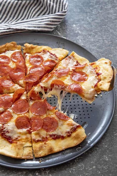 Here is how you make new york style pizza (and don't forget to get the full recipe with measurements, on the page down below): Easy Thin Crust Pizza Recipe