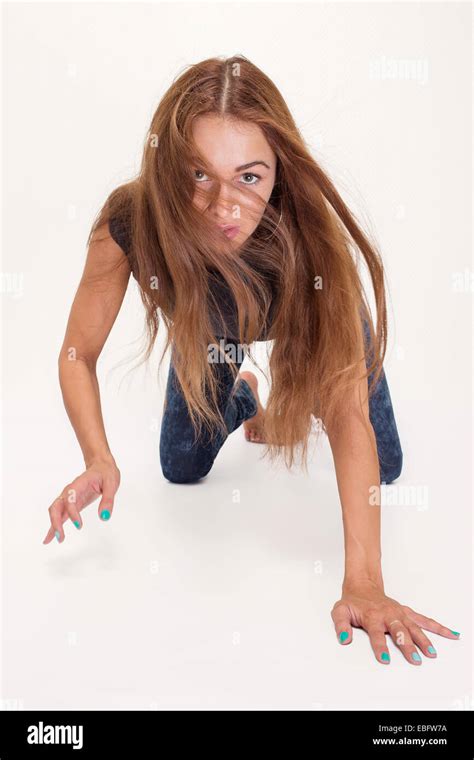Girl Is On All Fours Posing Looking On Camera Stock Photo Alamy
