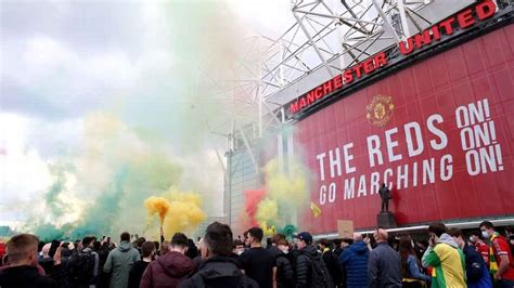 Photos Man United Supporters Invade Old Trafford Pitch In Protest Against Glazer Ownership