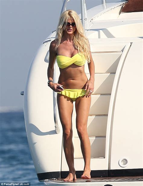 Victoria Silvstedt Shows Off Her Bronzed Body In A Canary Yellow Bikini