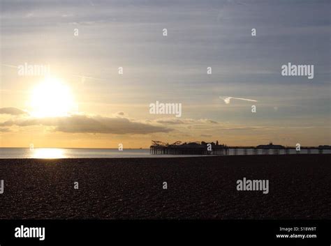 Sunset Over Brighton Pier Stock Photo Alamy