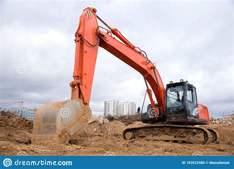 Red Excavator During Earthworks At Construction Site Backhoe Digging
