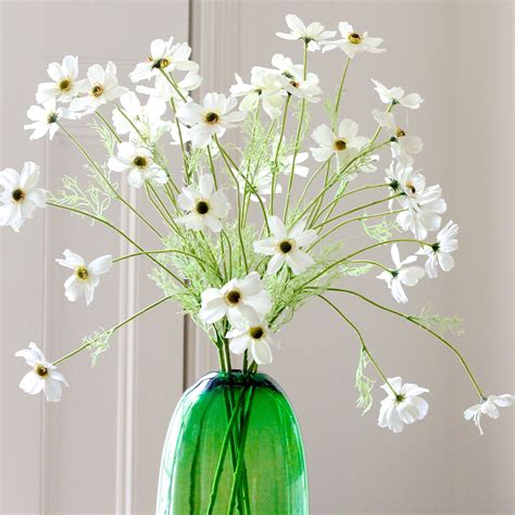 Soft stems are comfortable to hold the flowers are held in a beautiful white plastic vase with a wave style design. cosmos | Faux flowers, Artificial flowers, Glass vase