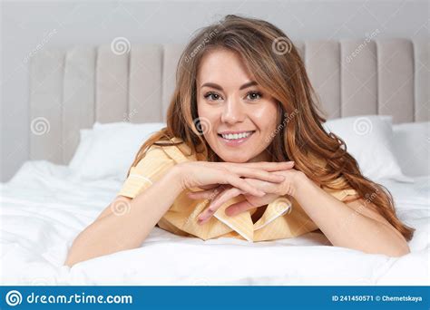 portrait of happy beautiful woman on bed at home stock image image of lazy awake 241450571