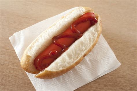 First Person View On Thick Hot Dog With Ketchup Free Stock Image