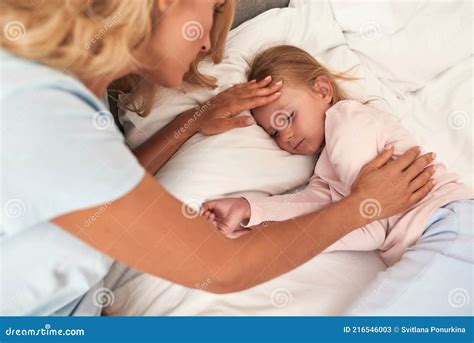 Mother Checks If Daughter Has Temperature Stock Image Image Of