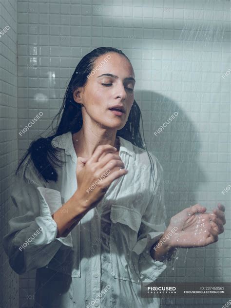 Woman Dressed Wet Standing In Shower Under Spraying Water — Depressed