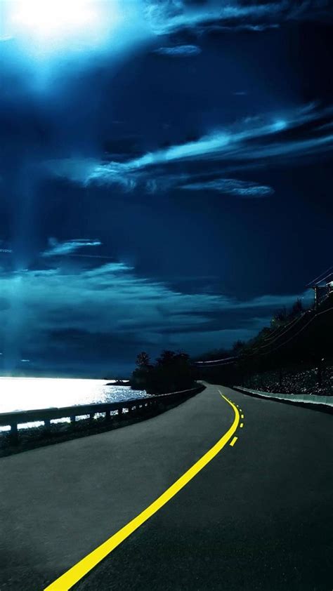 Download Qhd Coastal Road At Night Wallpaper
