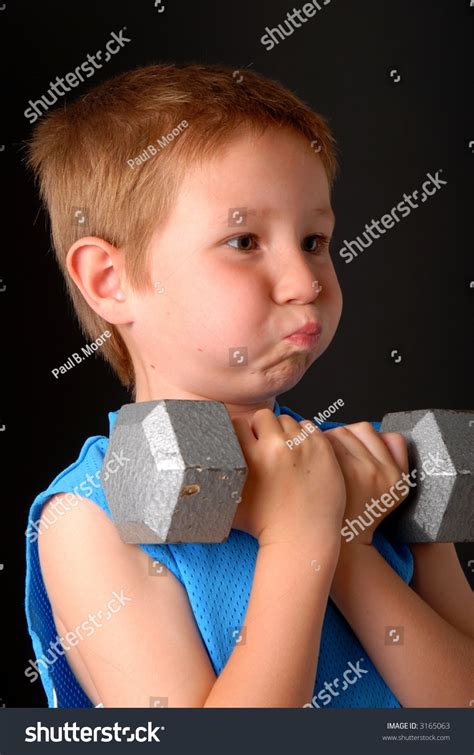 Young Boy Lifting Weight That Heavy Stock Photo 3165063 Shutterstock