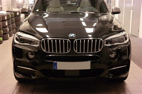 Compare vehicle values in usa. Black Sapphire BMW X5 M50d F15 2014 with 22" winter wheels delivery photos