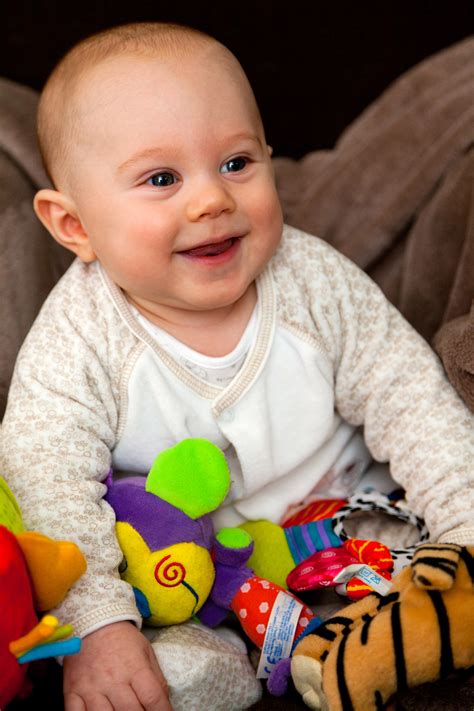 Smiling Baby With Toys Free Stock Photo Public Domain Pictures