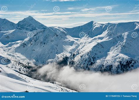 Mountain And Valleys Covered With Snow And Clouds Stock Image Image