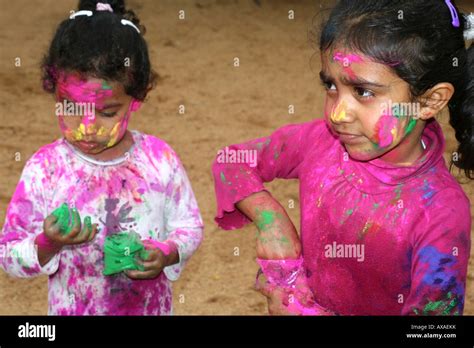 Two Young Indian Girls Playing Holi At The Indian Spring Festival Holi
