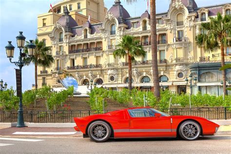 Red Luxury Car In Front Of Hotel De Paris At Monte Carlo Monaco