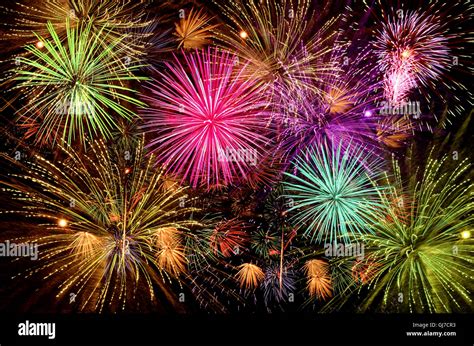 Colorful firework celebration on dark night sky background. Beautiful Stock Photo - Alamy