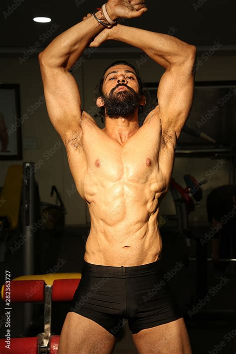 Bodybuilder Posing In Different Poses Demonstrating Their Muscles Male Showing Muscles