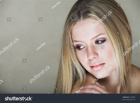 Young Beautiful Teenage Girl With Long Blond Hair And Blue Eyes In Low