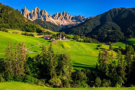Summer Alpine Landscape With Santa Maddalena Mountain Village