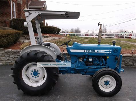 It is equipped with a 4 forward and 1 reverse. Ford 4100 Tractor - Canopy Top - Diesel - 2241 Hours