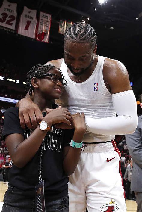 Dwyane Wade 3 Of The Miami Heat Hugs His Son Zion Wade After His