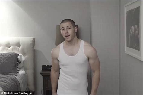 nick jonas flaunts his muscly biceps to announce new single levels daily mail online