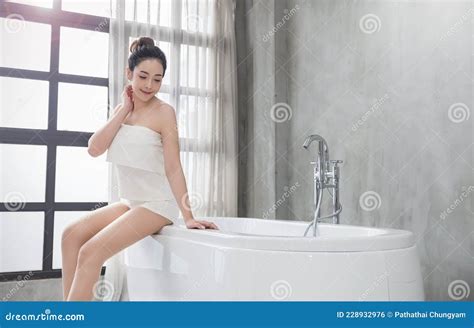 Portrait Of Young Attractive Asian Girl Takes A Bath Relax In Modern