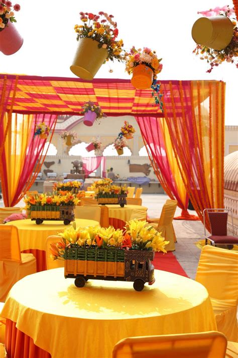 #wedding #indian_wedding #wedding_car_decoration simple indian wedding car decoration ideas with flowers. Hanging flower pots and decorated mini trucks as props for ...
