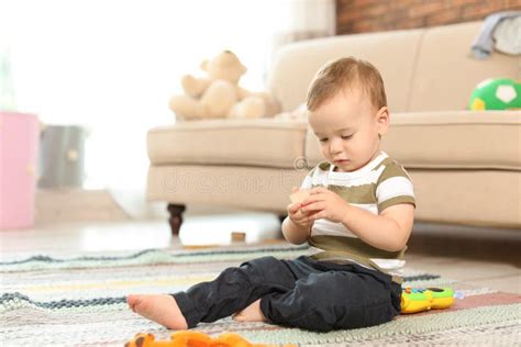 Adorable Little Baby Sitting On Floor Stock Image Image Of Lifestyle