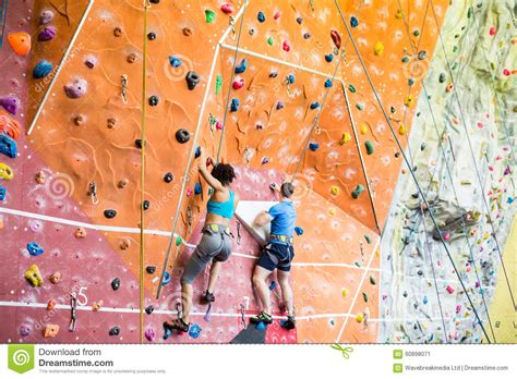 Fit Couple Rock Climbing Indoors Stock Image Image Of Recreational