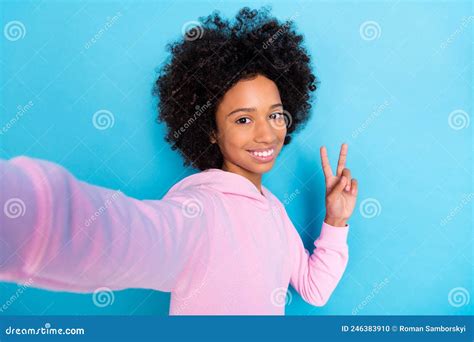 Self Portrait Of Beautiful Trendy Cheerful Brunet Bushy Haired Girl Showing V Sign Isolated Over