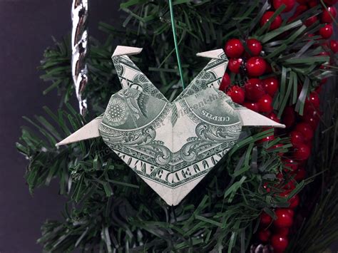 The origami lucky star is fairly simple to make. Money Origami Christmas Tree Ornament - Heart w/ two doves ...