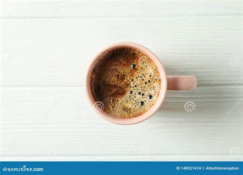 Cup Of Coffee With Frothy Foam On Wooden Background Space For Text And