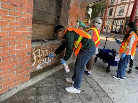 Volunteers Clean Up Graffiti In Chinatown
