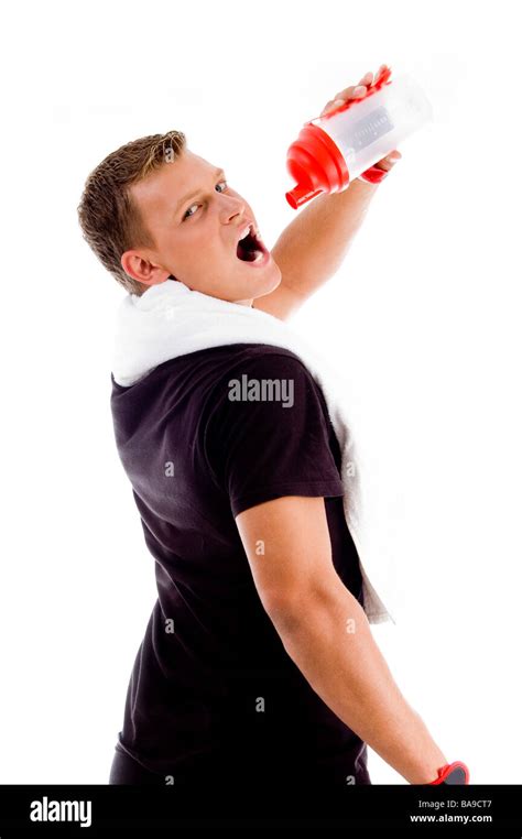 Back Pose Of Muscular Man Drinking From Water Bottle Stock Photo Alamy