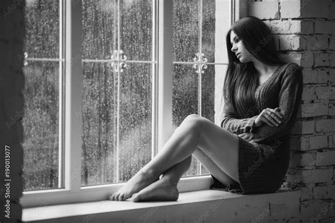 Beautiful Young Woman Sitting Alone Near Window With Rain Drops Sexy