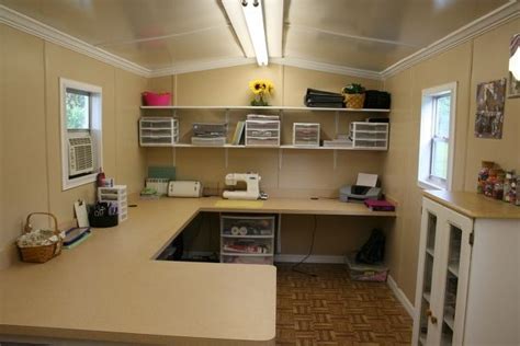 There are also kitchen cabinets towards the wall for a small pantry and hung up high for closed storage. Why have a craft room when you can have a craft SHED ...