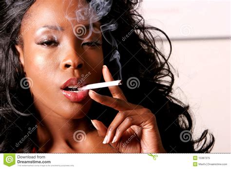Beautiful African American Woman Smoking Cigarette Stock