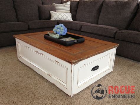 As you can see, each box can face outward to provide extra storage shelves, while the stunning stained wood surface offers a place for drinks and more. DIY Coffee Table with Storage | Free Plans | Rogue Engineer