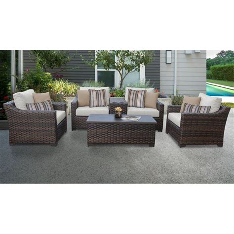 An Outdoor Patio Furniture Set With Red And White Cushions