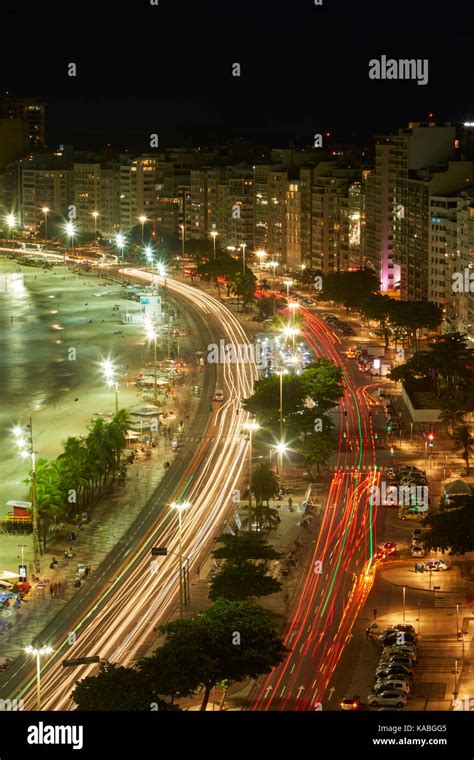 Traffic Along Avenida Atlantica And Copacabana Beach At Dusk Rio De