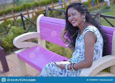 An Indian Woman Using Mobile Phone And Smiling On Outdoor Stock Image Image Of Laughing