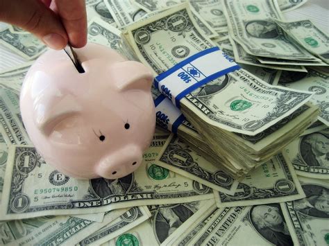 How you spend your money impacts your credit score and the amount of debt you end up carrying. Money - Savings | Saving Money in a piggy bank for the ...